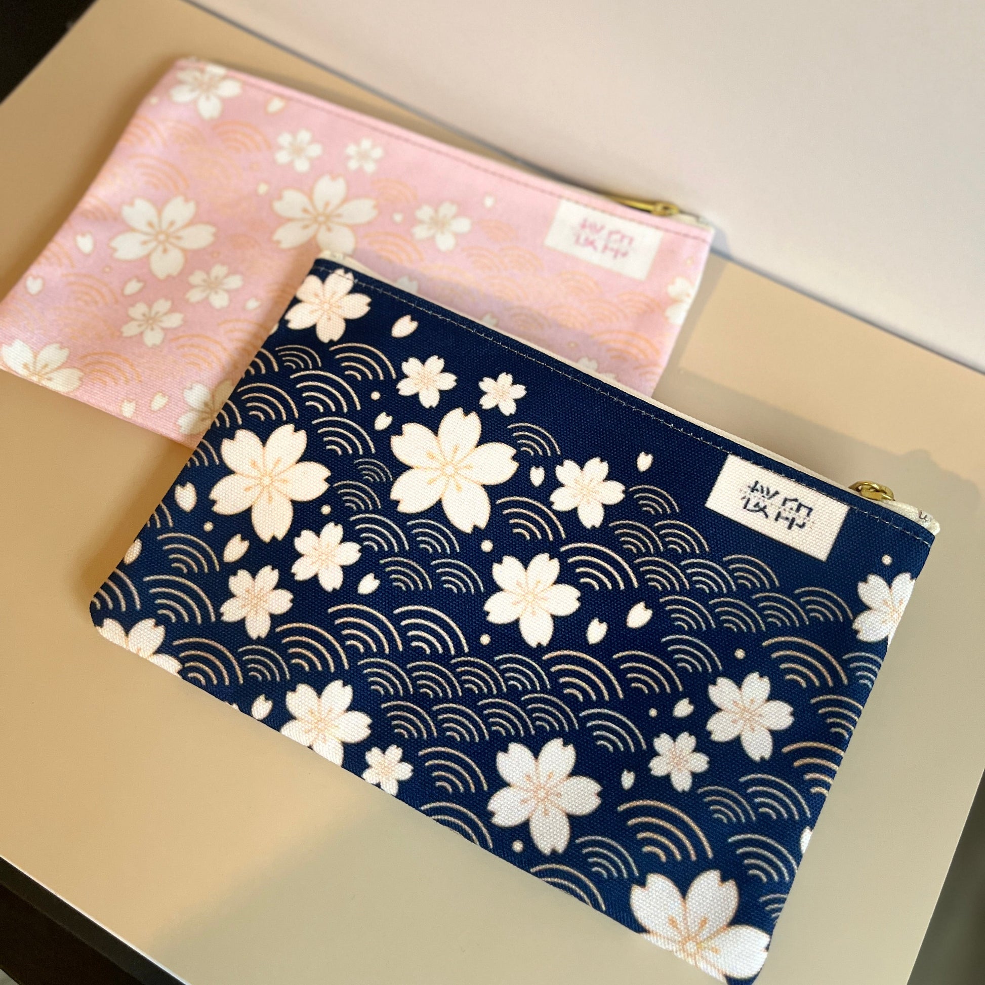 Two pouches with Sakura Cherry blossom patterns on